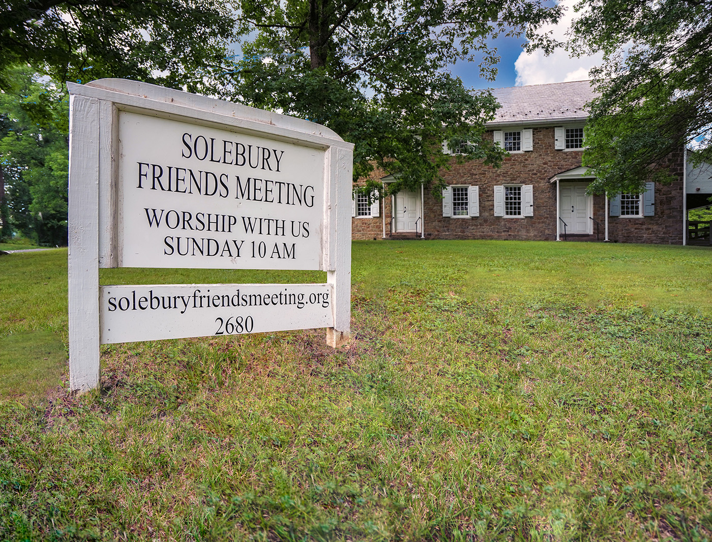 Photograph of the Solebury Friends Meeting Sign: Worship with us - Sunday at 10 am